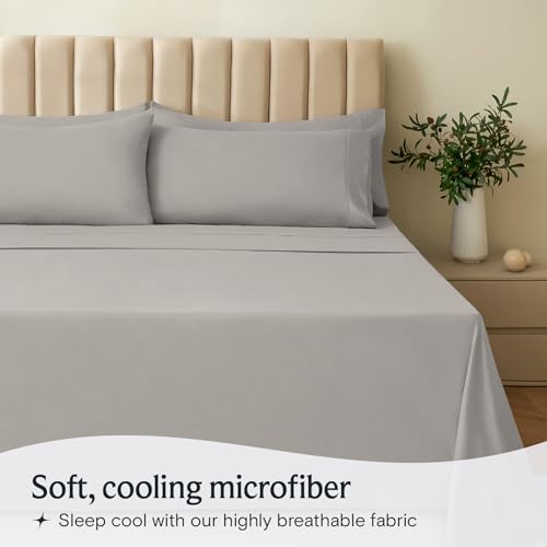 a bed with a plant in a vase with text: 'Soft, cooling microfiber Sleep cool with our highly breathable fabric'