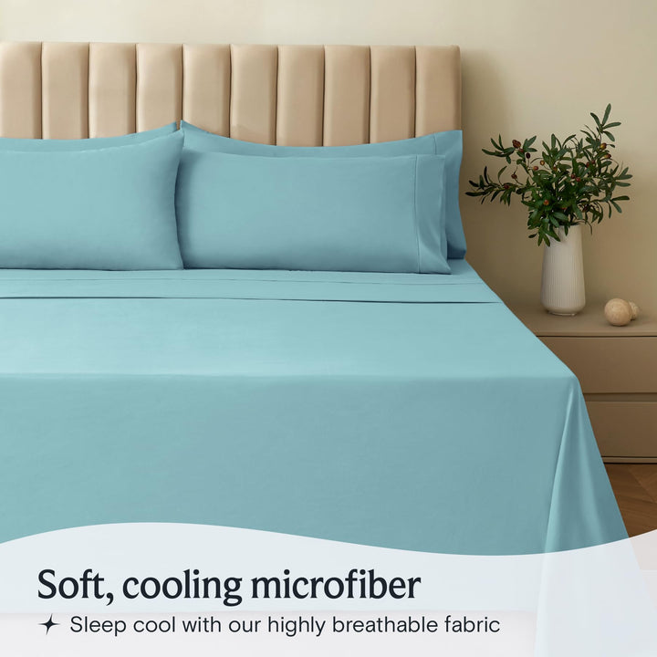 a bed with a plant in a vase with text: 'Soft, cooling microfiber Sleep cool with our highly breathable fabric'