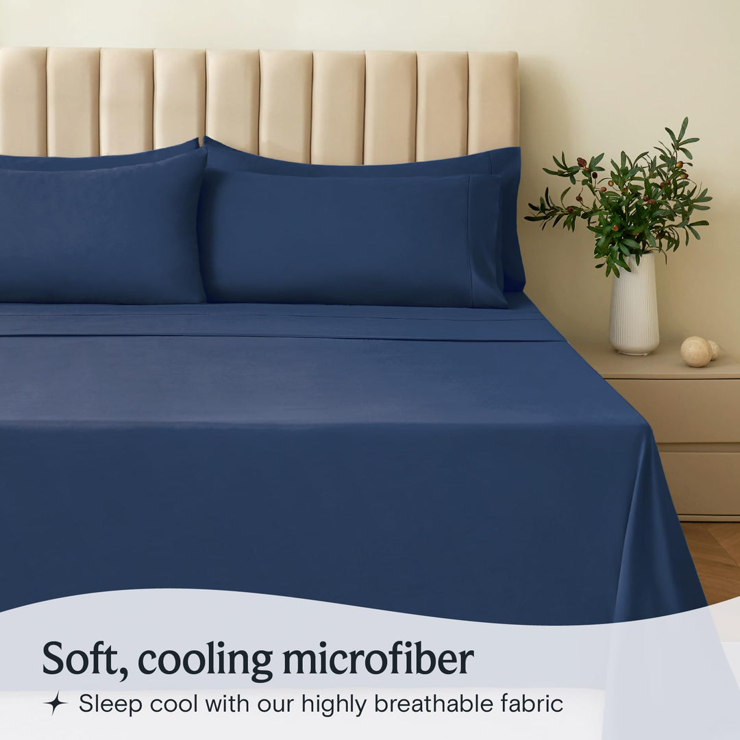 a bed with blue sheets and pillows with text: 'Soft, cooling microfiber Sleep cool with our highly breathable fabric'