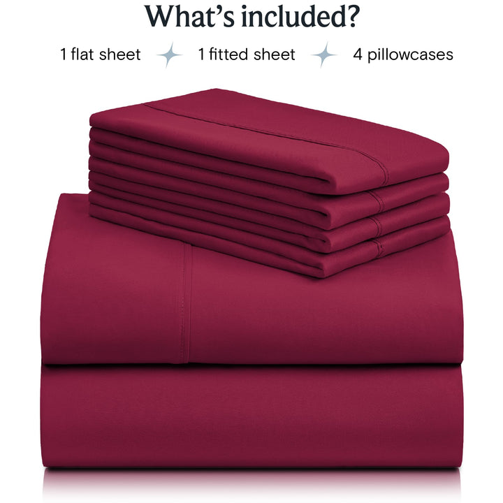 a stack of red sheets with text: 'What's included? 1 flat sheet 1 fitted sheet 4 pillowcases'