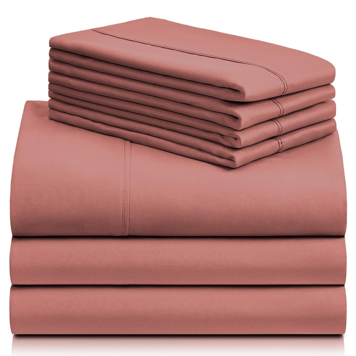 a stack of pink sheets