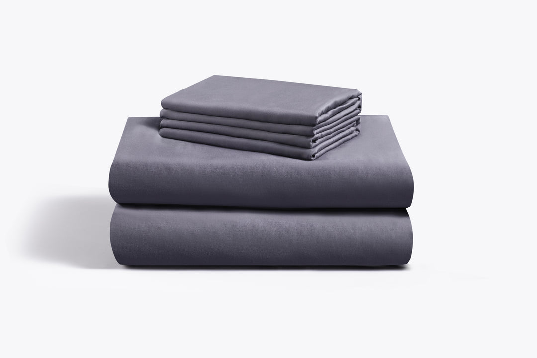 a stack of folded blankets