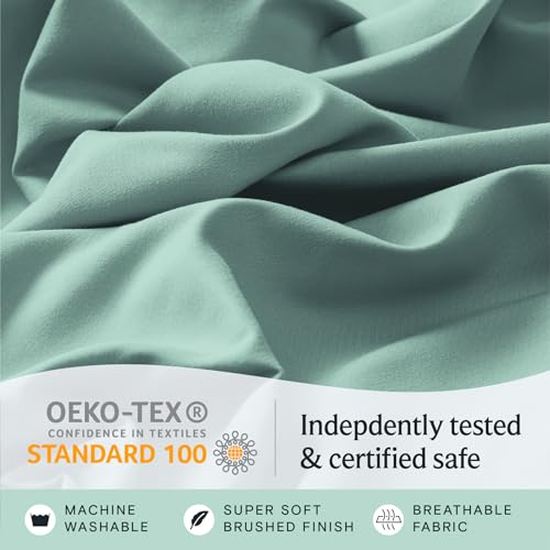 a close up of a fabric with text: 'OEKO-TEX Indepdently tested CONFIDENCE IN TEXTILES STANDARD 100 & certified safe MACHINE SUPER SOFT BREATHABLE WASHABLE BRUSHED FINISH FABRIC'