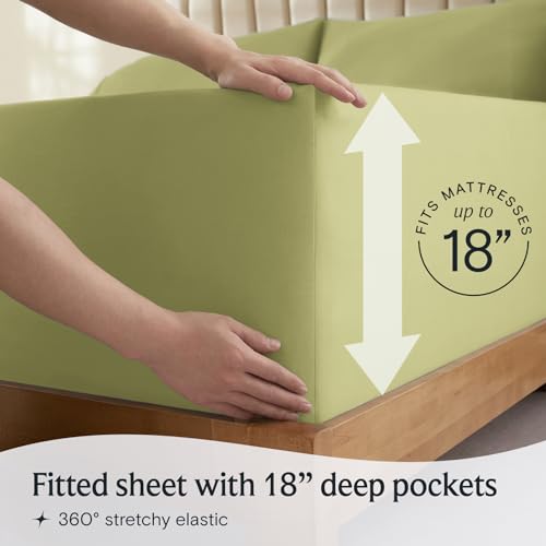 a person holding a mattress with text: 'RESSES FITS MA 18 Fitted sheet with 18" deep pockets 360º stretchy elastic'