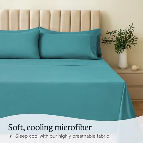 a bed with blue sheets and pillows with text: 'Soft, cooling microfiber Sleep cool with our highly breathable fabric'