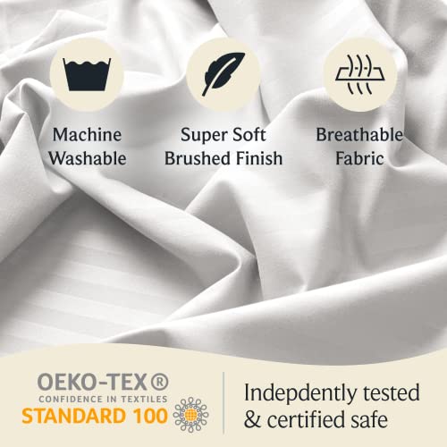 a close-up of a white sheet with text: '111 Machine Super Soft Breathable Washable Brushed Finish Fabric OEKO-TEX Indepdently tested CONFIDENCE IN TEXTILES STANDARD 100 & certified safe'