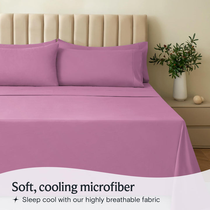 a bed with purple sheets and pillows with text: 'Soft, cooling microfiber Sleep cool with our highly breathable fabric'