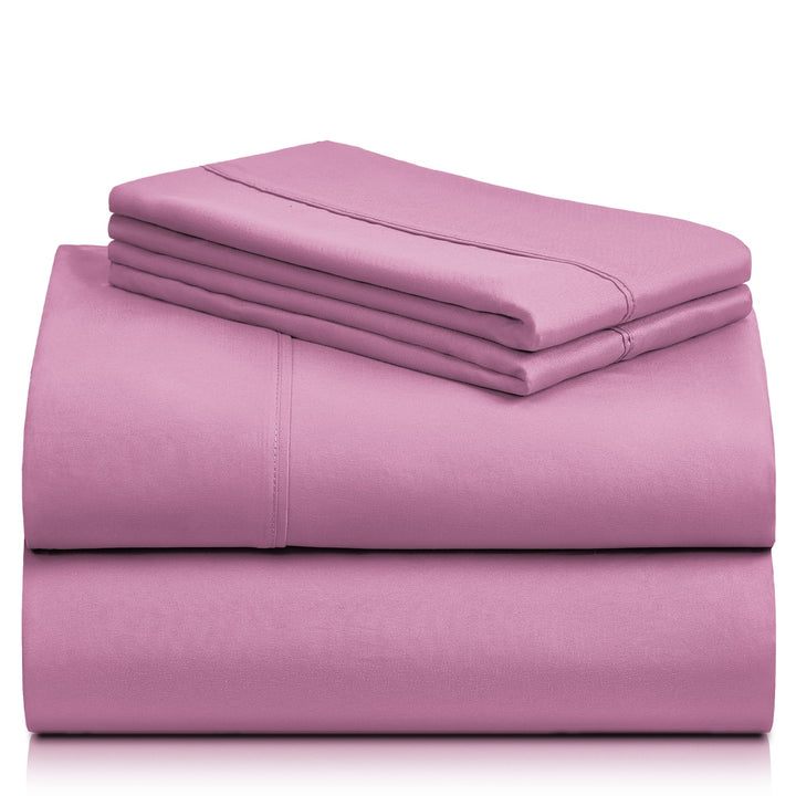 a stack of pink sheets