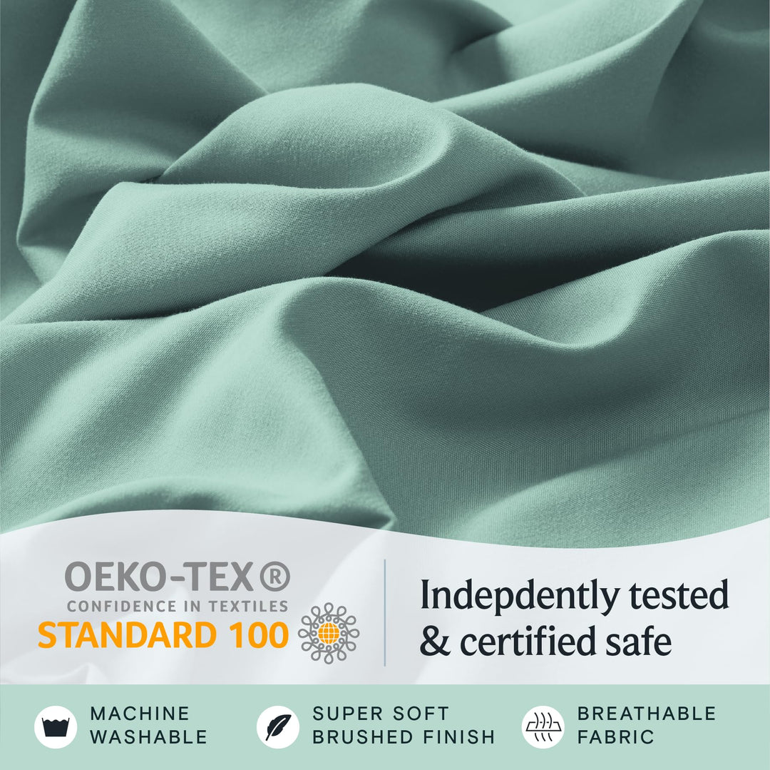 a close up of a fabric with text: 'OEKO-TEX Indepdently tested CONFIDENCE IN TEXTILES STANDARD 100 & certified safe MACHINE SUPER SOFT BREATHABLE WASHABLE BRUSHED FINISH FABRIC'