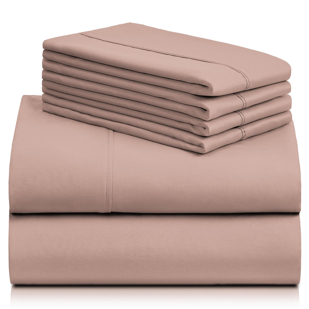 a stack of pink sheets