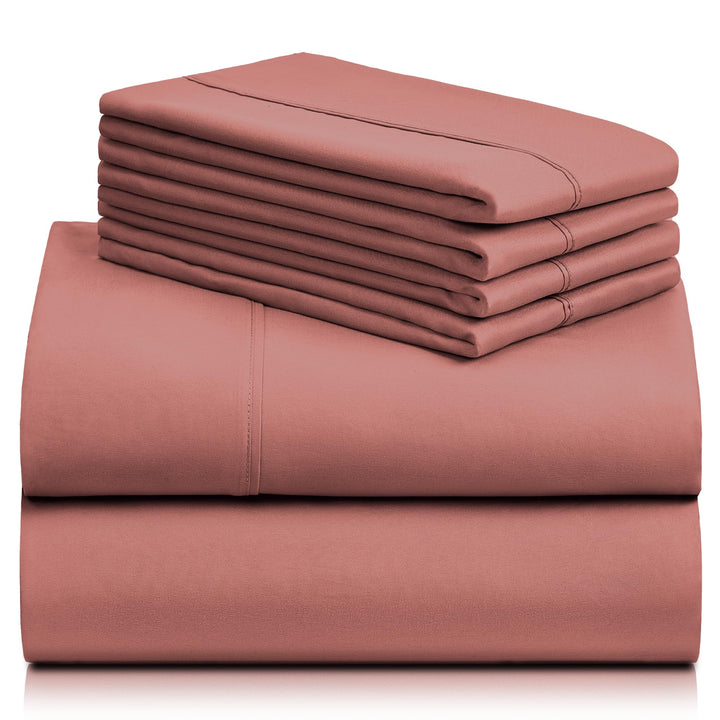 a stack of pink sheets